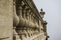 Small pillars supporting an old stone railing vase shaped decoration in Buda palace, Budapest, Hungar