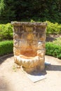 Stone reservoir with a spout for mineral water