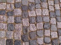 Stone road is grey. The background of the granite cobblestone pavement. Abstract background of the old cobblestone pavement. Royalty Free Stock Photo