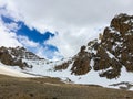 Stone rocks protruding from under the snow. Royalty Free Stock Photo