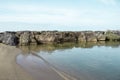 Stone rocky shore against the backdrop of the sea ocean. Summer mood Royalty Free Stock Photo