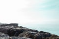 Stone rocky shore against the backdrop of the sea ocean. Summer mood Royalty Free Stock Photo