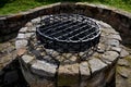 Stone round fountain with a protective grid of twisted prisms. forged steel bars go spiraled at the top. around the well there is