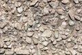 Stone rubble in the concrete wall as background Royalty Free Stock Photo