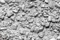 Stone rubble in a concrete wall painted with silver paint as a background Royalty Free Stock Photo