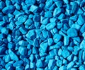 Stone rubble painted with blue paint. Background