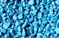 Stone rubble painted with blue paint. Background