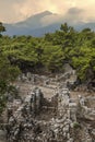 Stone ruins of houses and the street of the ancient city of Phaselis. Royalty Free Stock Photo