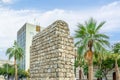 Stone ruins of old arab buildings with palms on the street of Al-Balad, Jeddah, Saudi Arabia