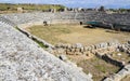 The stone ruins with the parts of sits and staircases of ancient antic stadium in Perge, Turkey