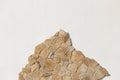 Stone sample rough mountain rock solid object white light wall pattern background empty space blank abstract facade Royalty Free Stock Photo