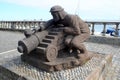 Stone sculpture of a cannoneer lighting a fuse of a naval gun, Povoacao, Sao Miguel, Azores, Portugal