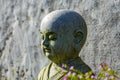A stone sculpture of a child monk Royalty Free Stock Photo