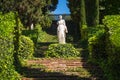 Stone sculpture of a classical woman in a garden Royalty Free Stock Photo