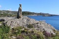 Stone sculpture in a coastal landscape in Norway, Europe.