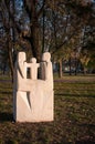 Stone sculpture on green grass