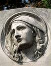 Stone sculpture of a grieving woman