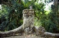 Stone sculpture of a group of monkeys live monkey in a tropical green forest Royalty Free Stock Photo
