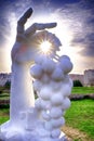 Stone sculpture of a hand who holding wine grapes