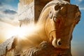 Stone sculpture of a horse in Persepolis against a sunrise. Iran. Persia. Shiraz.