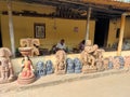 Stone sculpture and poor artisans working in the workshop for creating Hindu and Buddhist idols.