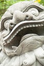 Stone sculpture of smiling Chinese lion
