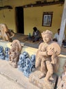 Stone sculpture and traditional artisans working in their workshop for creating Hindu and Buddhist idols.