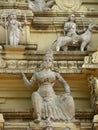 Bangalore, Karnataka, India - June 2, 2010 Stone sculptures and statues of Hindu deities on gopuram at Bull Temple