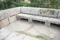 Stone seat built on the side of a Roman bridge, in Merida, Spain