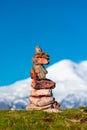 Stone seid on the background of the snow-capped peak of Mount Elbrus high Royalty Free Stock Photo