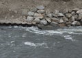 stone shoring on the river bank