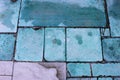 Stone slabs outdoors with Copper oxidation stains