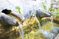 Stone source of drinking water comes from a mountain - image wit