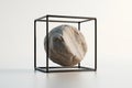 Rough stone sphere inside minimalist black cube frame, white background, contrasting textures, art installation Royalty Free Stock Photo