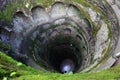 Stone spiral staircase in the form of a well. view from above