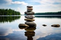 stone stack balanced on a serene lakeside