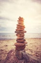 Stone stack pyramid on a beach, zen, harmony and balance concept, color toning applied Royalty Free Stock Photo