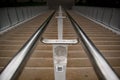 Stone stair with a chrome railing in the middle