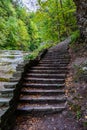 Stone stair in forest in Buttermilk Falls State Park Royalty Free Stock Photo