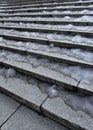 Stone staircase covered with ice in the city