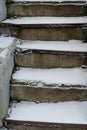 The stone staircase is covered with snow. Concept, winter has come, cautiously slippery. Royalty Free Stock Photo