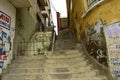 Stone staircase between houses with graffiti on the walls. La Paz, Bolivia
