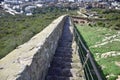 a stone staircase leading down to the coast.