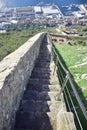 a stone staircase leading down to the coast.