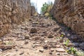 stone staircase leads through a passageway down to the sea Royalty Free Stock Photo