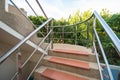 Stone staircase with stainless steel handrails