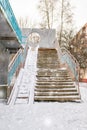 Stone staircase in winter in snow storm. Abstract snow-covered steps. Steps to nowhere. Gray stairs covered with white snow, close Royalty Free Stock Photo