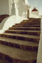 Stone stairs on entrance of white old church in small Mediterranean city Royalty Free Stock Photo