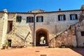 stone stairs and the gate of a historic building in the city of Sorano Royalty Free Stock Photo