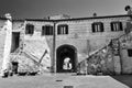 stone stairs and the gate of a historic building in the city of Sorano Royalty Free Stock Photo